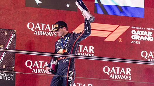 First place driver celebrating victory at Qatar Grand Prix 2023 on podium.