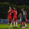 Balestier Tigers players celebrating during a football match against Albirex.