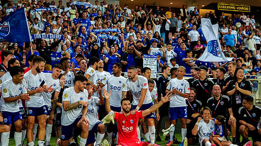 Singapore football team celebrates league title after Tampines draw victory.